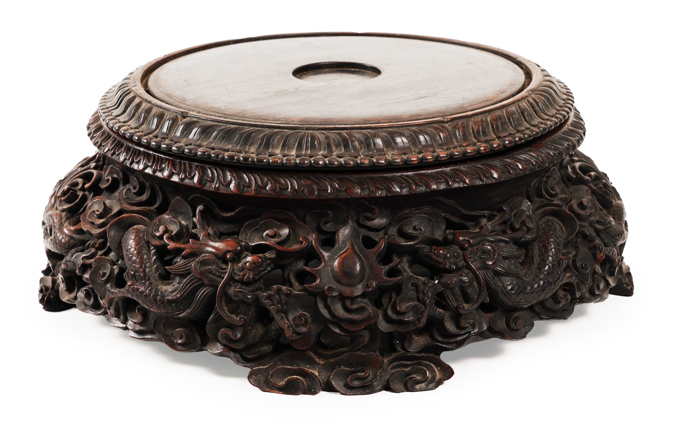 An impressive Chinese hongmu ‘dragon’ stand, late 19th century